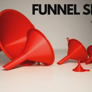 May include: A set of six red funnels of varying sizes. The funnels are made of plastic and have a smooth finish. The text "FUNNEL SET" and "6 SIZES" is displayed in black. The funnels are designed for pouring liquids.