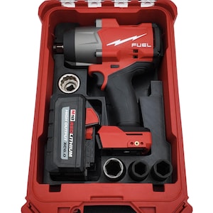 May include: A red and gray FUEL impact wrench kit. The kit includes the impact wrench, a battery, and sockets, all housed in a red carrying case. The battery is labeled "M18 REDLITHIUM HIGH OUTPUT XC6.0".