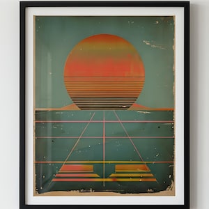 Puede incluir: Impresión artística enmarcada con un diseño de puesta de sol retro. La obra de arte muestra un gran sol naranja y amarillo sobre líneas horizontales, con formas geométricas y líneas en rosa y amarillo debajo. La impresión está enmarcada en un marco negro.