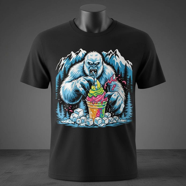 May include: Black t-shirt featuring a colorful graphic of a yeti enjoying a rainbow-colored ice cream treat. The design includes mountains, trees, and ice cubes, creating a fun, whimsical scene. The yeti is depicted with blue fur.