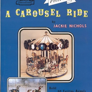 May include: A stained glass design pattern for a carousel ride with 60 animals. The pattern is titled "A Carousel Ride" by Jackie Nichols. The image shows a colorful carousel with horses and other animals.