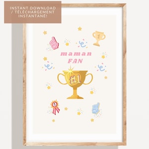 Puede incluir: Una impresión enmarcada con un fondo claro presenta un trofeo dorado, confeti, estrellas y las palabras "maman FAN" en rosa. Gráficos adicionales incluyen un dedo de espuma y una cinta. El texto "INSTANT DOWNLOAD / TÉLÉCHARGEMENT INSTANTANÉ!" está en la parte superior.
