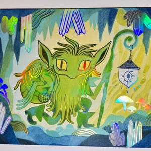 May include: A playmat featuring a green goblin-like creature with red eyes, holding a staff and lantern. The background depicts a cave with crystals and mushrooms. The playmat has a holographic effect and the text "MATS BY LIZ" is visible.