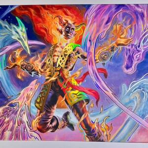 May include: A vibrant playmat featuring a fantasy illustration of a figure with fiery hair and horns, surrounded by swirling elemental creatures in shades of blue, purple, and orange. The playmat has the text "MAGIC" and "MATS BY LIZ".