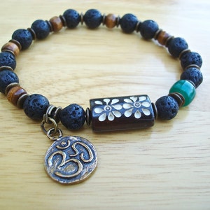 Mens Om Good Fortune bracelet with Black Lava, Recycled Green Glass, Antique Tibetan Bronze Om double sided, Carved Bone, Wood, Brass - Yoga