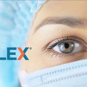 May include: Close-up of an eye with the text "NCLEX" in blue and orange. The person is wearing a surgical mask and a blue surgical cap. The eye is light blue and has long eyelashes.