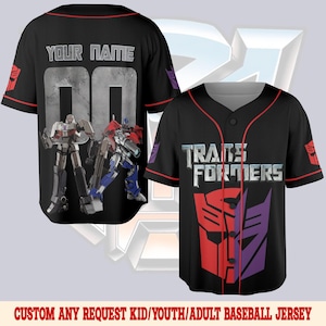 May include: Black baseball jersey with red trim and the text "TRANSFORMERS" in silver. The jersey features the Autobot and Decepticon logos, and images of Optimus Prime and Megatron. The back has the text "YOUR NAME" and the number "00".