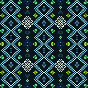 May include: Geometric pattern in shades of blue, green, and white on a dark background. The design features repeating diamond and square shapes, creating a textured, pixelated effect. The pattern is symmetrical and visually engaging.
