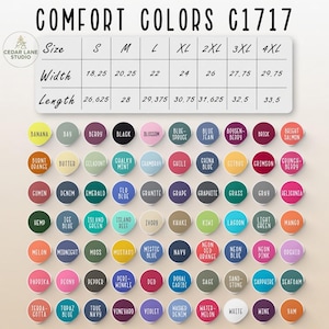 Puede incluir: Tabla de colores para ropa Comfort Colors C1717, con tonos como Banana, Negro y Denim. La tabla incluye tallas y medidas, con anchos de 46,35 cm a 75,57 cm y largos de 67,63 cm a 85,09 cm. El texto dice 'COMFORT COLORS C1717'.