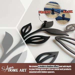 May include: Black metal leaf wall art with a modern shadow effect. The image shows the front and back of the leaf design, which is mounted with hidden spacers. The text reads "Solura Home Art".