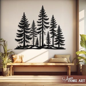 May include: Black metal wall art depicting a forest scene with several pine trees of varying sizes. The artwork is mounted on a white wall above a wooden bench with pillows. The overall theme is nature and home decor.