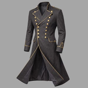 May include: A dark grey military-style coat with gold trim and buttons. The double-breasted coat features a long, tailored design with a notched collar, gold buttons, and gold trim along the edges and cuffs. The coat is open at the bottom.