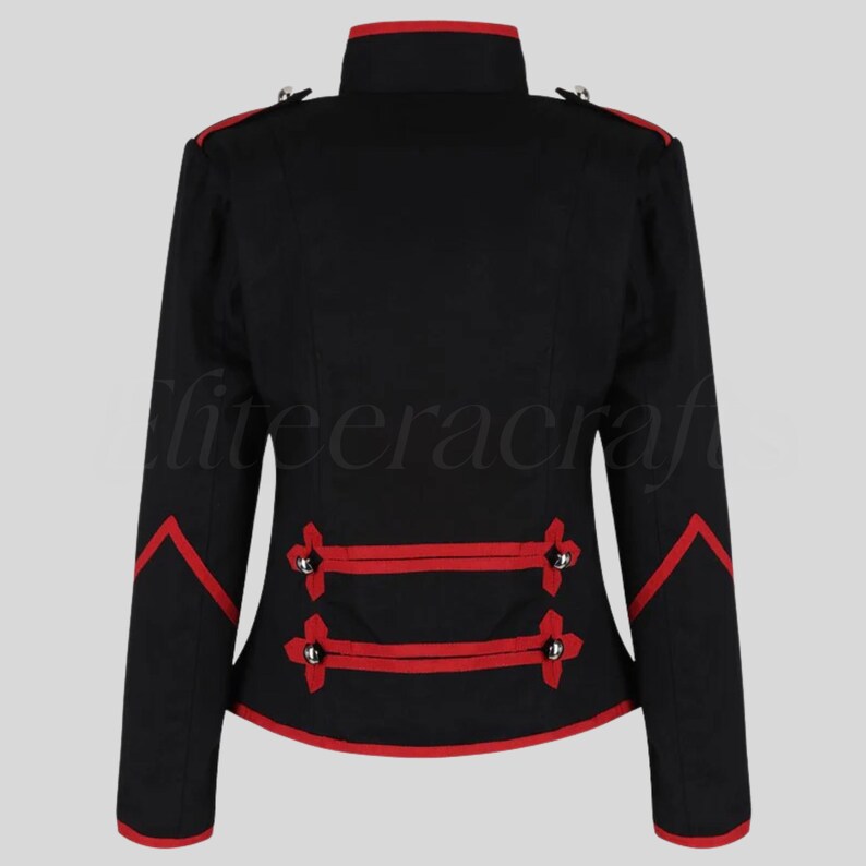 May include: Black jacket with red trim and accents. The jacket features a high collar, decorative silver buttons, and red piping along the edges and sleeves. The back view showcases the tailored design and military-inspired style.