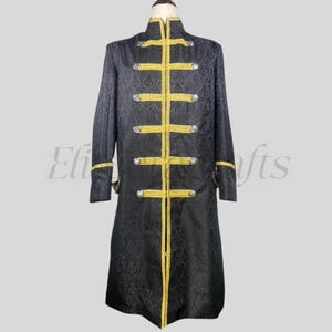 May include: Black long coat with gold trim and decorative buttons. The coat features a high collar and intricate floral pattern in the fabric. The gold trim accents the front, cuffs, and collar. A formal garment.