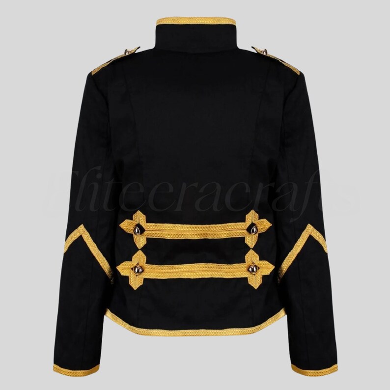 May include: Black jacket with gold trim and accents. The jacket features a high collar, gold braid detailing on the sleeves and back, and decorative gold buttons. The jacket's design is reminiscent of military or formal wear.
