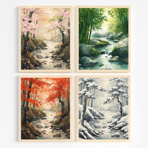 Puede incluir: Cuatro impresiones artísticas enmarcadas de paisajes. Las impresiones representan serenas escenas de ríos con árboles en diferentes estaciones: flores de cerezo en primavera, bambú en verano, arces rojos en otoño y pinos cubiertos de nieve en invierno.