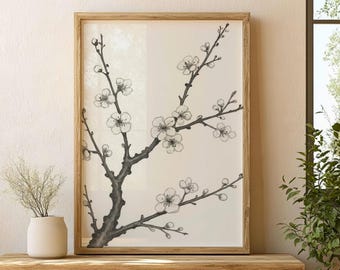 Peut inclure: Une impression d'art encadrée représentant une illustration en noir et blanc d'une branche d'arbre en fleurs. L'œuvre a un style minimaliste avec des fleurs délicates et un cadre en bois naturel. L'impression est affichée sur une surface en bois.
