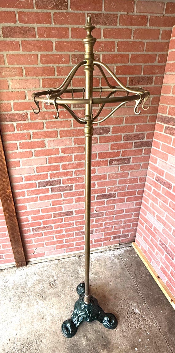 vintage dress rack Antique Early 20th Century Ornate Cast Iron Rounder Garment  cityFoundry six side hooks Vintage Industrial Rolling Garment Rack