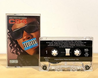 May include: A black cassette tape with the text "Original Motion Picture Soundtrack CB4" and "HQ. HE PRO" printed on it. The cassette tape is in a clear plastic case.