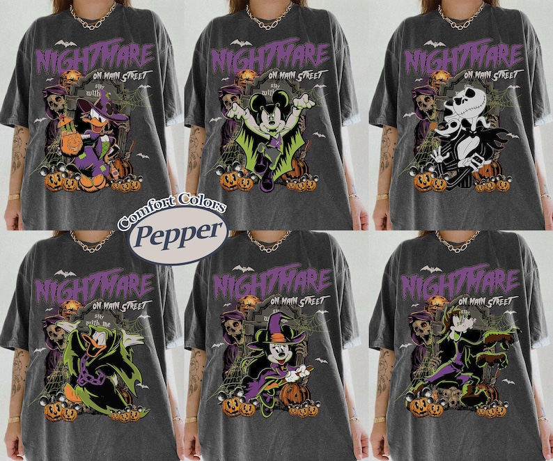 May include: Dark gray t-shirts with Halloween-themed graphics. Each shirt features a different character from a popular animated movie, with the words "Nightmare on Main Street" in purple. The shirts are from Comfort Colors.