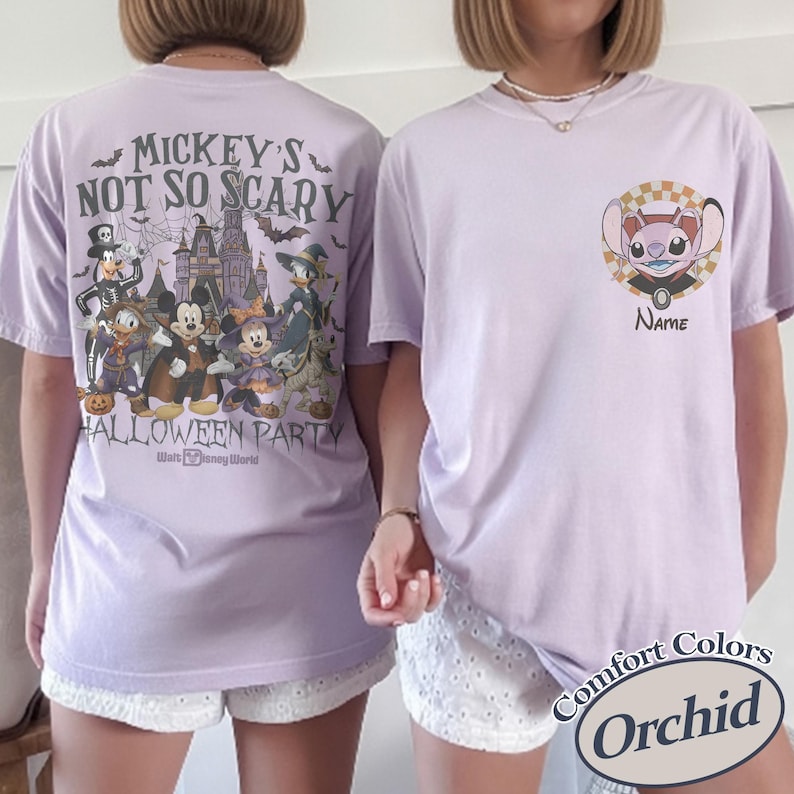 May include: Two light purple t-shirts. One features a Halloween design with Disney characters and the text "Mickey's Not So Scary Halloween Party". The other shirt has a character design with the text "Name". Both shirts are Comfort Colors brand.