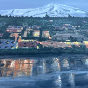May include: A painting of a snowy mountain peak with a small town at the base. The town is lit up with warm yellow lights, and the water in the foreground reflects the lights.