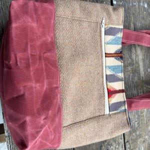 May include: A rustic wooden sign with the text "Welcome to our home" in white lettering. The sign features a distressed finish and a simple, inviting design, perfect for entryway decor.