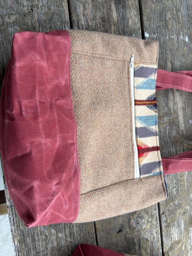 May include: A rustic wooden sign with the text "Welcome to our home" in white lettering. The sign features a distressed finish and a simple, inviting design, perfect for entryway decor.