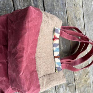 May include: A rustic wooden sign with the text "Welcome to our home" in white lettering. The sign features a distressed finish and a simple, inviting design, perfect for a front porch or entryway.