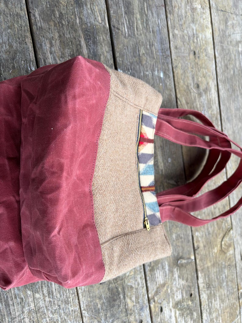 May include: A rustic wooden sign with the text "Welcome to our home" in white lettering. The sign features a distressed finish and a simple, inviting design, perfect for a front porch or entryway.