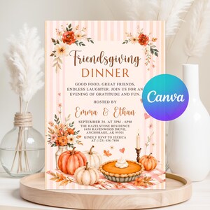 May include: A rectangular Friendsgiving dinner invitation card featuring a light pink striped background, watercolor floral accents, and pumpkins. The text reads: Friendsgiving DINNER, GOOD FOOD, GREAT FRIENDS, ENDLESS LAUGHTER. JOIN US FOR AN EVENING OF GRATITUDE AND FUN. HOSTED BY Emma & Ethan, SEPTEMBER 28, AT 3PM - 6PM, THE HAZELSTONE RESIDENCE 8450 RAVENWOOD DRIVE, ANCHORAGE, AK 99501, KINDLY RSVP TO JESSICA AT (123) 456-7890.