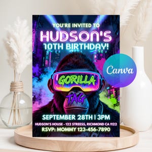 May include: A birthday party invitation featuring a gorilla wearing neon VR goggles with the words "GORILLA TAG". The invitation reads "HUDSON'S 10TH BIRTHDAY!" with the date, time, and RSVP information. The background has a futuristic city design.