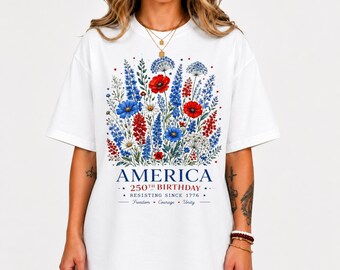 アメリカ建国250周年記念シャツ、愛国的な花柄Tシャツ、1776年以来抵抗を続けるシャツ、アメリカ独立記念日シャツ、7月4日Tシャツ