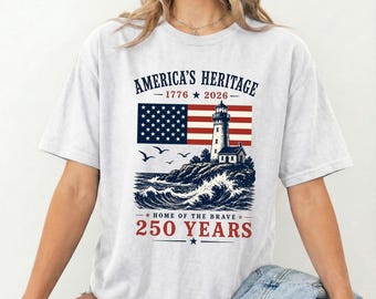 アメリカの遺産シャツ、灯台愛国シャツ、勇者の故郷Tシャツ、250周年記念シャツ、アメリカ国旗ヴィンテージTシャツ、独立記念日シャツ