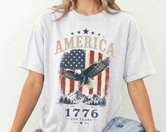 アメリカ1776イーグルシャツ、250周年愛国Tシャツ、ヴィンテージUSA国旗シャツ、独立記念日シャツ、アメリカ記念日Tシャツ