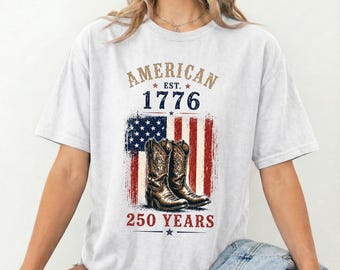 アメリカンカウボーイブーツシャツ、愛国的なウエスタンTシャツ、ヴィンテージUSA国旗シャツ、250周年記念シャツ、カントリー独立記念日Tシャツ