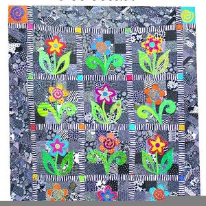 May include: A colorful quilt with the text "Black and Bloomin'". The quilt features a black and white patchwork design with vibrant floral appliqués in various colors, including pink, orange, yellow, and blue. The flowers have green stems and leaves.