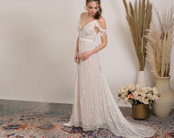 Dreamy lace wedding dress, boho chic style that enhance and flatter an unforgettable stunning boho silhouette.