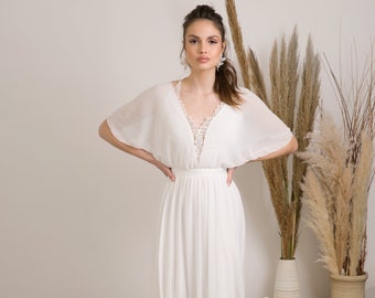 Delicate and effortlessly beautiful bohemian wedding dress handmade from soft chiffon adorn with lace neckline, kimono sleeves and a train.
