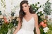 Simple and effortlessly stunning bohemian wedding dress. Delicate wedding dress with lace top, open back, wrap skirt, a slit and a train 