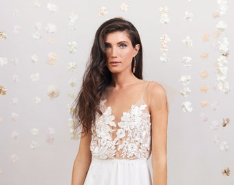 Floral embroidery  wedding dress with embroidered lace, an open back, a flowy skirt and a slit