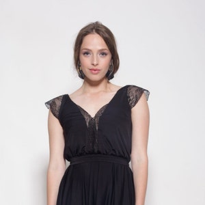 Black dress knee length, lace cleavage and sleeves ,bell shape skirt image 1