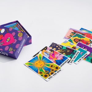 Rainbow Heart Tarot card deck with some cards out of the box- colorful tarot card deck with groovy retro stylization