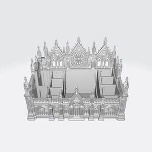 Puede incluir: Modelo gris impreso en 3D de una catedral, con intrincados detalles arquitect&oacute;nicos. El modelo tiene m&uacute;ltiples compartimentos y una fachada detallada con ventanas arqueadas y elementos decorativos. El dise&ntilde;o recuerda a la arquitectura g&oacute;tica.