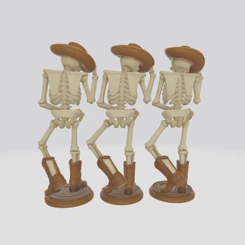 May include: Three skeleton figurines wearing cowboy hats and boots. The skeletons are beige and brown, with the hats and boots in a darker shade of brown. Each skeleton is standing on a round, brown base.