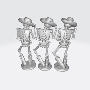 May include: Three gray skeleton figurines wearing hats and boots, posed in a dancing stance. Each skeleton is standing on a round base. The figures are set against a plain, light gray background.