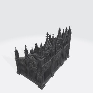Puede incluir: Una valla decorativa de estilo g&oacute;tico, de color gris oscuro, con intrincados detalles arquitect&oacute;nicos. La valla presenta arcos apuntados, tracer&iacute;a ornamentada y un dise&ntilde;o de ventana circular. La est&eacute;tica general recuerda a una catedral o estructura medieval.