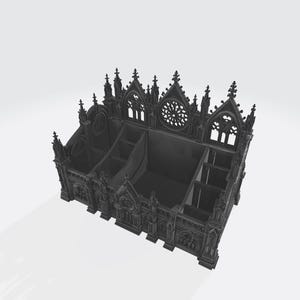 Puede incluir: Un organizador de escritorio negro de estilo g&oacute;tico con m&uacute;ltiples compartimentos. El organizador presenta intrincados detalles arquitect&oacute;nicos, incluyendo ventanas arqueadas, agujas y un dise&ntilde;o de roset&oacute;n. La est&eacute;tica general recuerda a una catedral o iglesia.
