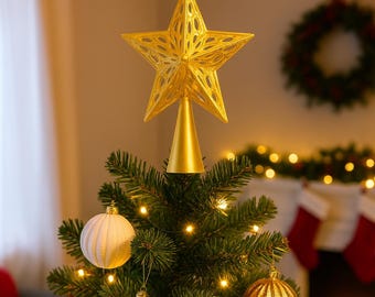 May include: A gold star tree topper with an intricate openwork pattern, placed on a decorated Christmas tree with baubles and lights. The star is about 25 cm tall, perfect for festive holiday decorations.