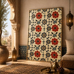 May include: A rectangular wall art piece in a gold frame featuring a repeating pattern of red flowers with dark blue centers, dark blue leaves, and geometric star shapes on a cream background. The design is symmetrical and vertically oriented.